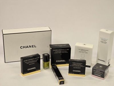 chanel cosmetics products displayed on a white surface with a white background