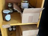 a wooden shelf with boxes and jars of food on it