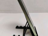 a cell phone sitting on a stand on a table