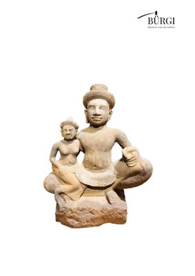 an image of a statue of a man and a child sitting on a rock