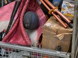 a basket full of stuff that is sitting in the back of a truck