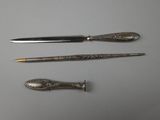 three different types of silverware are displayed on a white surface