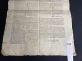 an old document with writing on it sitting on a table