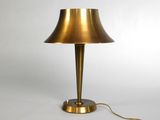 an image of a brass table lamp on a white background