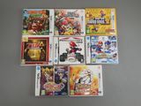 plusieurs jeux Nintendo Wii posés les uns à côté des autres sur une table