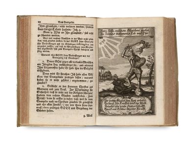 un livre ouvert sur lequel figure le dessin d'un homme tenant une épée