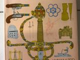 une photo d'un livre posé par terre, sur lequel figurent des illustrations