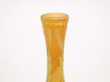 a yellow vase that is sitting on a table
