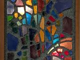 une photo d'une photo d'une mosaïque accrochée au mur