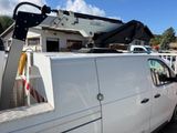 a white truck with a crane on the back of it