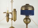 pair of brass table lamps with blue fringes and a brass table lamp
