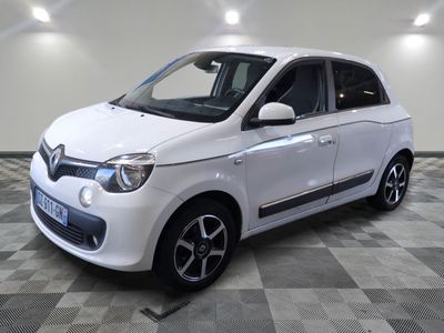a picture of a small white car on a checkered floor