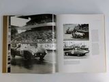 an open book with a picture of a race car and a picture of a man in a racing car