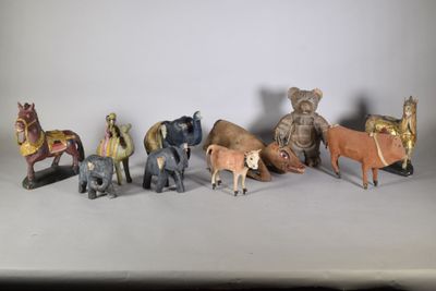 a lot of small figurines of animals on a table
