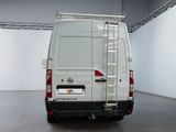 a white van with a ladder on the back of it