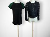 pair of mannequins in black and green with flowers