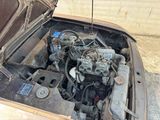 an old car with a very small engine in it
