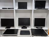 a desk with a keyboard, monitor, mouse, and monitor monitor on it