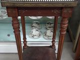 a small table that has a marble top on it