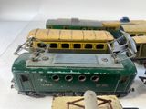 three toy trains sitting on a table next to each other