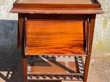 an old wooden table with a drawer on top of it