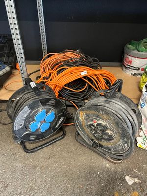 a pile of wires and other electrical equipment on the floor
