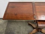 a wooden table with a drawer on top of it
