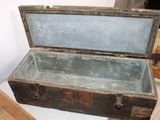 an old trunk sitting on top of a table