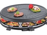 une photo d'un barbecue sur lequel sont disposés divers aliments