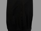 a close up of a pair of black pants on a gray background
