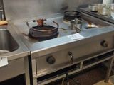 a kitchen with a stove and a sink in it