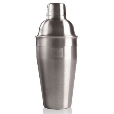 a close up of a metal cocktail shaker on a white surface