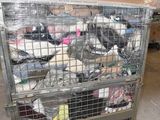a metal cage filled with lots of trash inside of a building