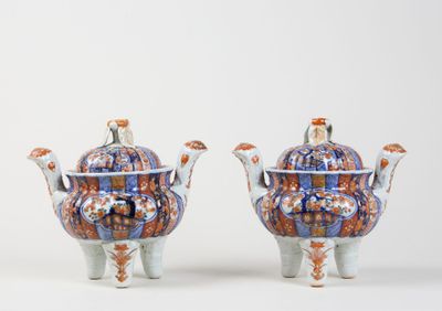 pair of blue and orange porcelain teapots with handles