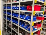 many bins and bins on the shelves in the warehouse