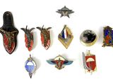 a lot of badges that are on a white surface