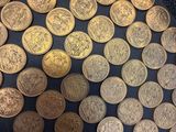 a lot of coins that are on the table