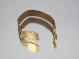 gold bracelet with a gold clasp and a gold bracelet with a gold clasp