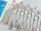 a lot of forks and spoons that are on a table