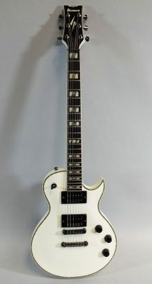 an electric guitar sitting on top of a white table