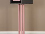 an image of a pink and black cabinet on a wooden floor