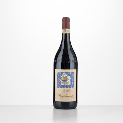 a bottle of red wine sitting on top of a table