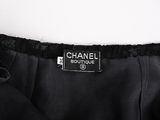 a chanel black dress with black lace trim