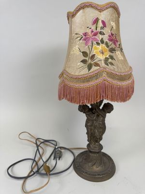 an image of a lamp that is on top of a table