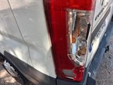 a close up of the tail light of a white van