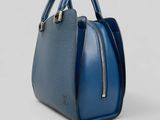 a blue handbag on a white background