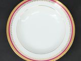 a close up of a plate on a table with a black background