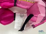 a close up of a pink stuffed animal with a tag on it
