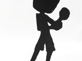 figurine of a man holding a boxing glove on a black base