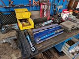 many tools that are sitting on a workbench